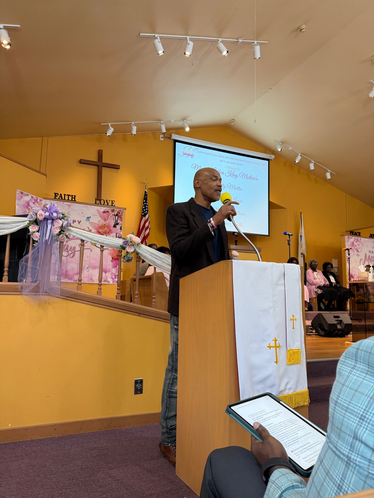 Church member speaking at the podium