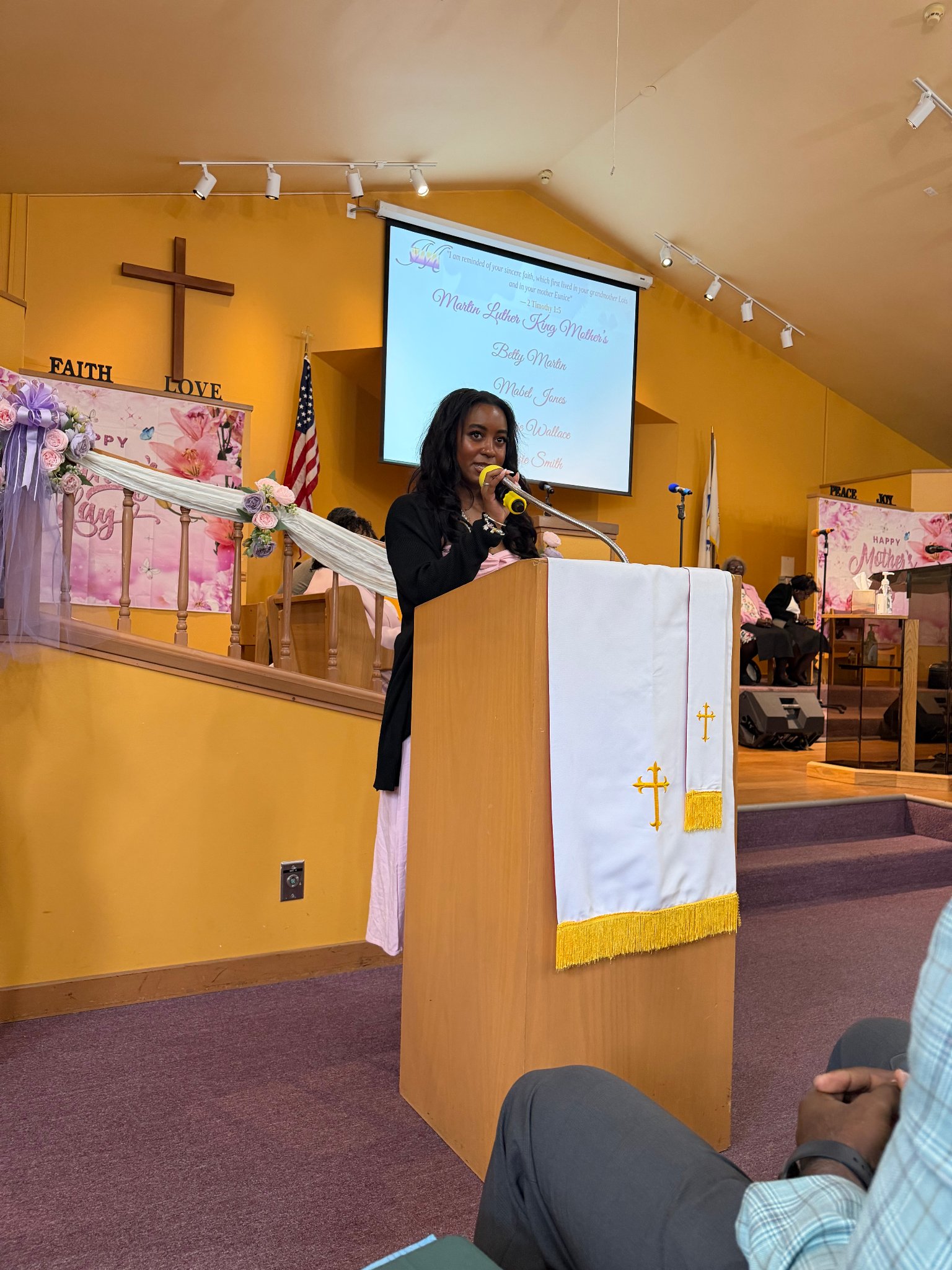 Church member speaking at the podium