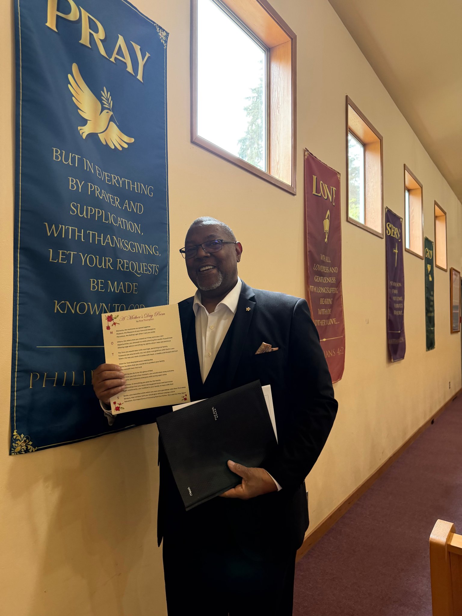 Deacon holding Mother's Day poem